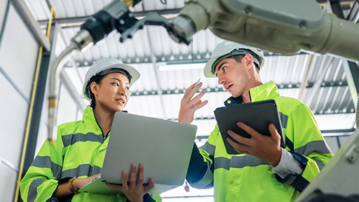 Skilled manufacturing employees working alongside automated production technology, illustrating how talent strategy has become central to every manufacturing challenge.