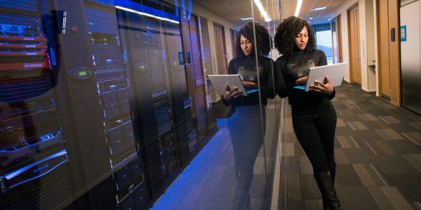 woman in black top using Surface laptop